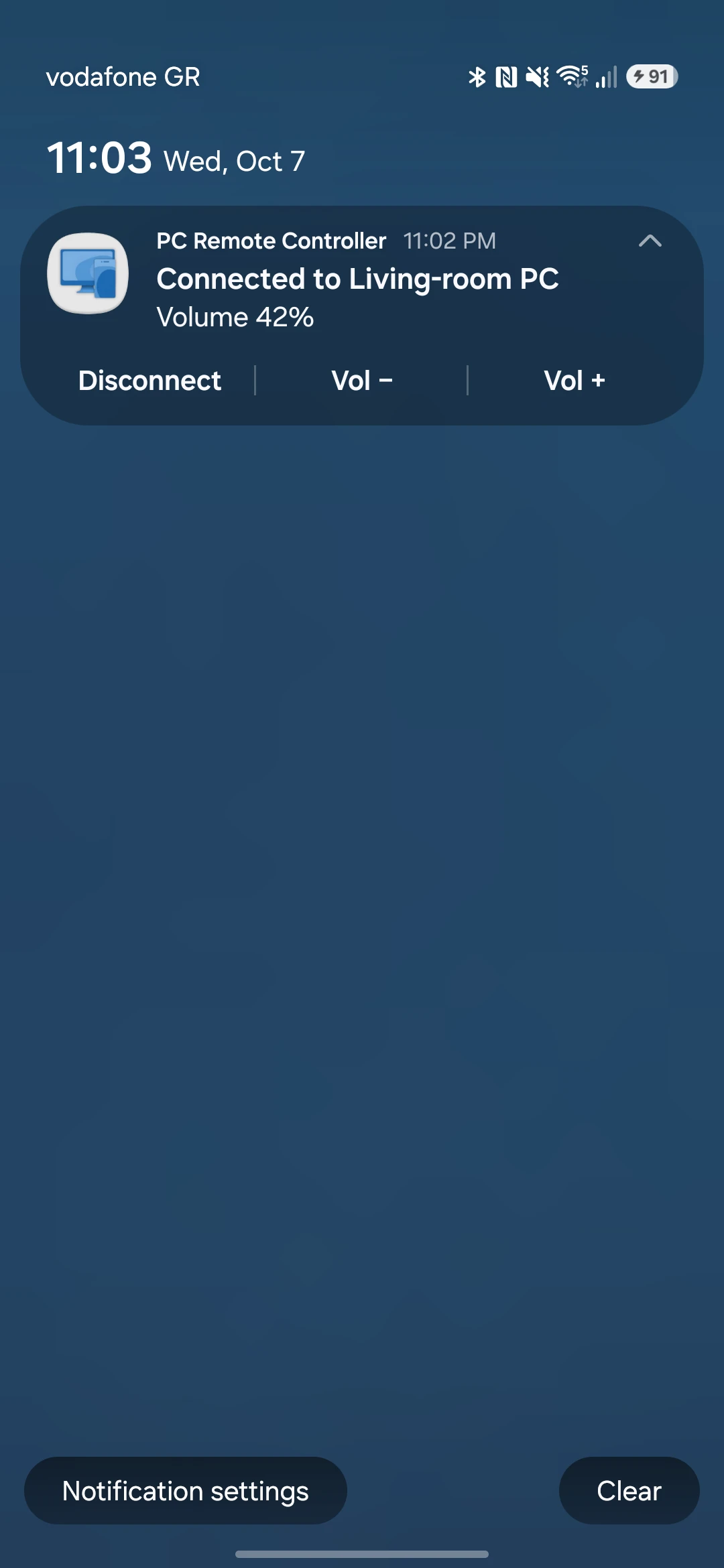 The notification: Connected to Living-room PC, Volume 42%, with Disconnect, Vol − and Vol +